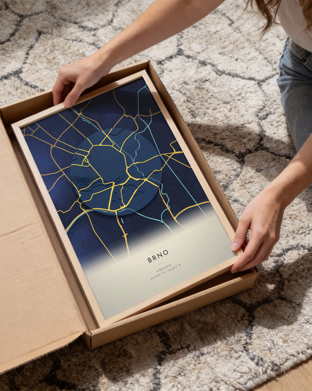 Brno 3D relief map in Nocturne, framed in a room